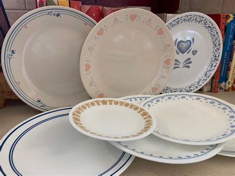 Corelle vintage patterns. A place setting of Corelle Friendship includes: 10¼-inch Dinner Plate, 6¾-inch Bread & Butter Plate, 18-ounce Soup/Cereal Bowl, and 11-ounce Stoneware Mug. Microwave and dishwasher safe. This pattern coordinates with CorningWare Friendship Bakeware. The Corelle Friendship dinnerware pattern was discontinued in 2018. 