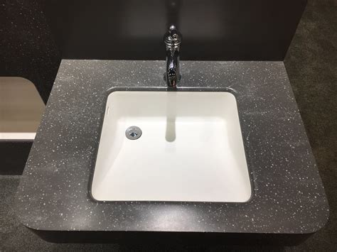 Step-by-Step Guide to Polishing Corian. Follow these steps to restore the factory finish: 1. Clean the Surface. Mix a mild soap and warm water solution. Dish soap works well for everyday cleaning. Dip a soft-bristled scrub brush into the solution and gently scrub the entire surface.. 