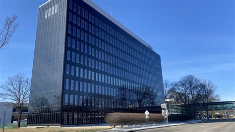 Corning leader news.  Headquarters Building, others sit empty.  This full replica of...