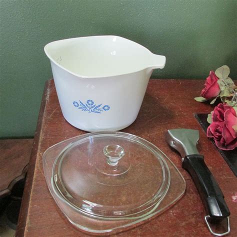 Corning Ware Blue Cornflower Sauce Maker P-55-B with Handle 1958-88 USA 1 quart. Opens in a new window or tab. Pre-Owned. C $40.34. Top Rated Seller Top Rated Seller. or Best Offer. dsvintagefinds (488) 99.8%. from United States. Corning Ware 1 Quart "Blue Cornflower" dish P-1-B, with detachable handle.. 