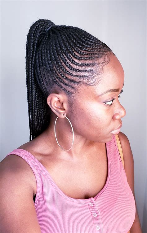 The ponytail updo features thin, neat braids that have been excellently spread out in a tight cornrow. A few blonde braids give it some sizzle and break the monotony of the black braids. The ponytail updo is simple and very practical—something that will not take a lot of time to style. 11. Intricately Ghana Braided Updo. 