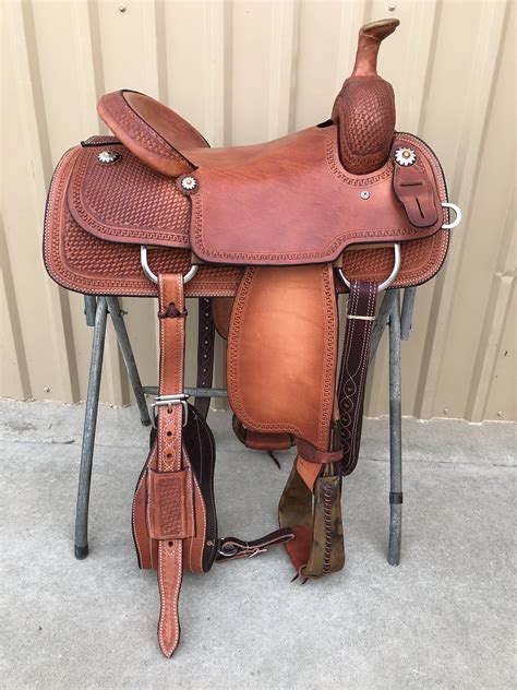 Jun 21, 2020 - TO ORDER PLEASE CALL US ***-***-**** SADDLE SPECIFICATIONS Real Wool Sheepskin Lining Available on All Saddle+$150 Association Ranch SaddleHalf Breed Smooth Out Basket Tooling Running W Trim Around Tooled Parts Straight Up Cantle 4 Strings Square Skirts Hard Seat Rawhide Stirrups FURTHER DETAILS This saddle is …. 