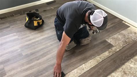 Measure the width of the room, and divide it by the width of the exposed portion of the plank before you start installing vinyl plank flooring. For example, if your room measures 123 in., and your flooring is 5.75 in. wide, you’d divide 123 by 5.75, which is 21.39. That is, it would take 21.39 planks to complete the floor.. 
