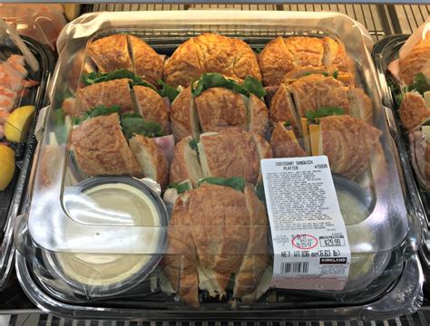 Costco sandwich tray. Costco offers croissant sandwich and chicken & Swiss roller platters in their party catering menu, serving 16-24 people each. Costco catering platters prices 2023: Prawn Platter: $49.98, Sushi Platter: $36.99, Buffalo Wings Platter : … 