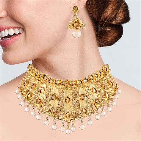 Costume jewellery online. From the delicate jhumkas that gracefully sway to the beat of every step, to the opulent chokers that accentuate the neckline with regal allure, below are Indian jewelry sets that you must try from our online store. Jhumka: An iconic and beloved style of big Indian earrings, jhumkas are known for their bell-shaped design and delicate danglings. 