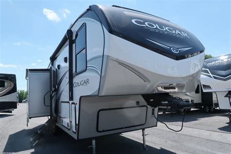 Keystone Cougar Half-Ton fifth wheel 27SGS highlights: Two Recliners. Sleeper Sofa. Peninsula Countertop. Booth Dinette. Opposing Slides. When you are ready to enjoy the fresh outdoor air, you'll want this Cougar Half-Ton fifth wheel to be there with you! The interior will feel spacious and comfortable because of the opposing slides, and you'll ... 