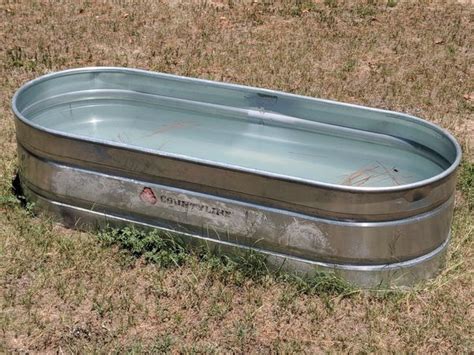 Due to its compact structure and elegant design, The CountyLine Galvanized Oval Stock Tank is a versatile piece that can be used for a variety of purposes. with a convenient size, this stock tank makes for a great planter, cooler, storage, display and more. SIZE: 3' W x 2' T x 8' L (All sizes listed are approximate and within a 2 inch variance). 