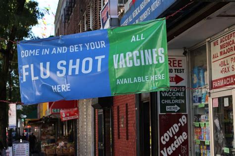 Covid-19 vaccination rates lag behind flu’s, but getting shots together may help
