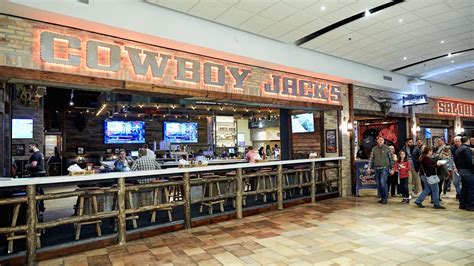 Cowboy jack. At about 10,000 square feet, the Cowboy Jack's space in Woodbury is quite a bit larger than the current Famous Dave's in Woodbury, which was 5,500 to 6,000 square feet, Hank said. "We think ... 