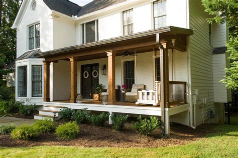 Craftsman house porch columns. A Craftsman front porch is all about symmetry, with its matching columns and cohesive aesthetics. You can bring that same symmetry to your home's exterior by doubling up on lanterns, hanging plants, and potted flowers . 