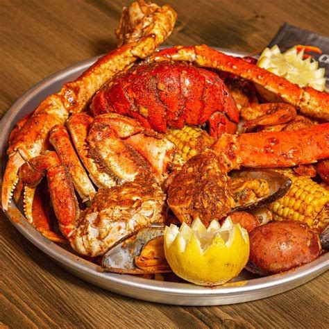 Blue Crab 4 pieces, 1/2 lbs headless shrimp, 2 corn & 2 shrimp. $24.99. They added 2 boiled eggs. Dungeness Crab was 1/2 lbs Aslo. 1/2 lbs whole shrimp & 1/2 lbs black mussel, 2 corn & 2 potatoes $25.99. Side choices...Fries, onion rings, sweet potato fries, hush puppies or broccoli. They even have something for the little people.. 