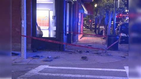 Crash damages light pole, front of phone store in Dorchester