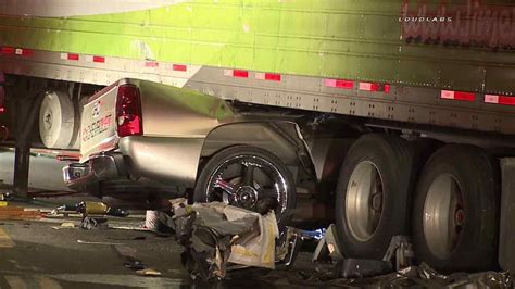 Crash leaves vehicle crushed under semi-truck on 10 Freeway