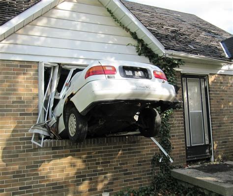 Crash sends car into side of home in Belmont