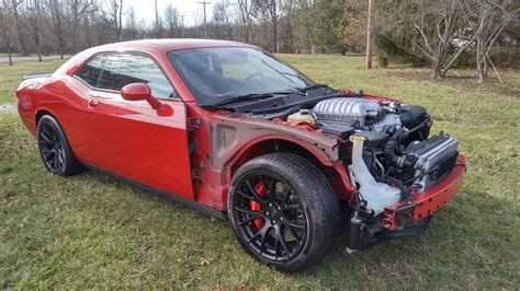 Crashed hellcat for sale. SRT Hellcats use a supercharged 6.2-liter supercharged V8 engine (717 hp, 650 lb-ft) The top dog, or cat, is the SRT Hellcat Redeye's even more powerful supercharged 6.2-liter V8 (797 hp, 707 lb ... 