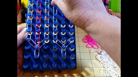 This is an instructional video showing how to make a new Over Easy Bracelet using the Rainbow Loom. This bracelet was made with the pins in a staggered posi.... 