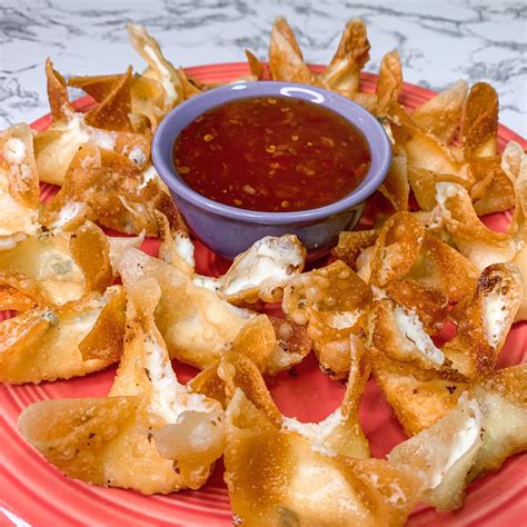Cream cheese rangoon. How to make Low Carb Crab Rangoon. Preheat your air fryer to 360 and lightly spray the basket for nonstick. In a medium bowl, combine together the cream cheese, green onions, crabmeat,garlic, mayonnaise, and sugar alternative. If this mixture seems to be too thick and hard to work with, add an additional … 