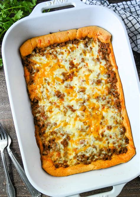 Crescent roll taco bake. Crescent roll taco bake recipe is an easy weeknight meal. Open one tube of crescent rolls and unroll the crescent dough. Separate the triangles and lay the … 