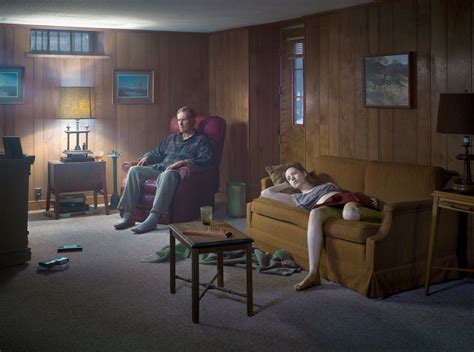 Crewdson. Gregory Crewdson (born September 26, 1962) is an American photographer who makes large-scale, cinematic, psychologically-charged prints of staged scenes set in suburban landscapes and interiors. He directs a large production and lighting crew to construct his images. 
