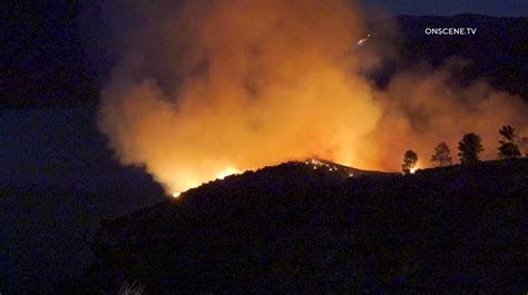 Crews battle brush fire burning near Castaic Lake