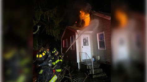 Crews battle fire in Kingston home