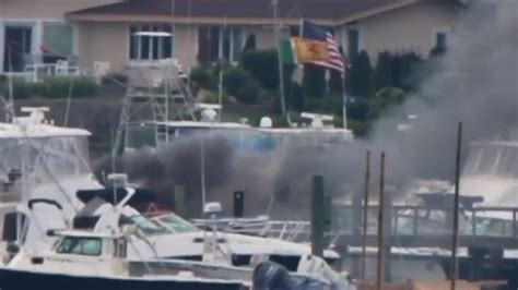 Crews battle large fire on boat in Onset