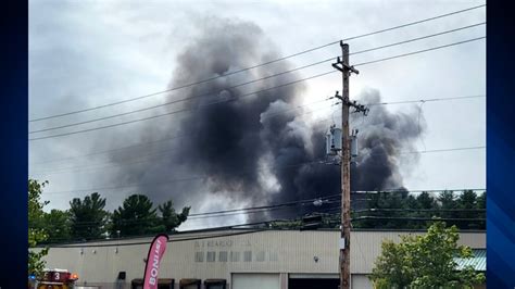 Crews battle large junkyard fire in Billerica