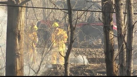 Crews continue work to contain Wednesday brush fire