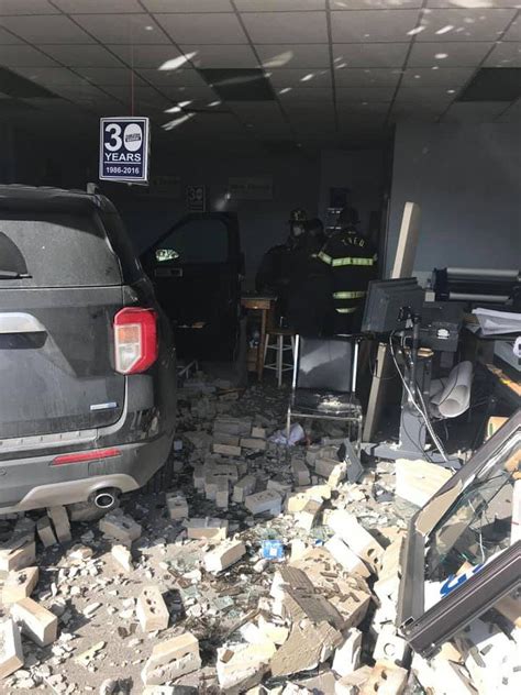 Crews respond to car into building in Back Bay