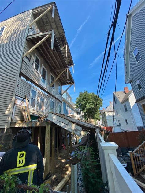 Crews work to contain 4-alarm fire in Dorchester that led to porch collapse