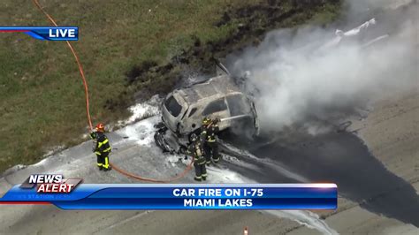 Crews work to put out car fire on I-75 in Miami Lakes