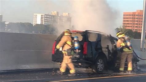 Crews work to put out flames after car catches on fire in Miami