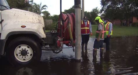 Crews working to pump standing water from flooded Dania Beach neighborhood