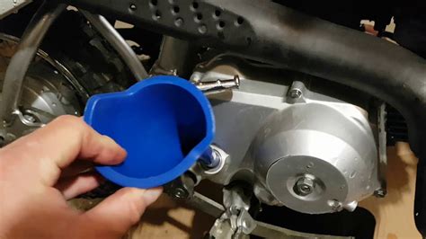 The recommended engine oil capacity for the Honda CRF50F (2021) is approximately 0.6 liters (or 0.63 US qt). It is crucial to check the oil level regularly and consult your manual for the correct oil type and maintenance intervals. How do I adjust the chain tension on my Honda CRF50F (2021)?. 