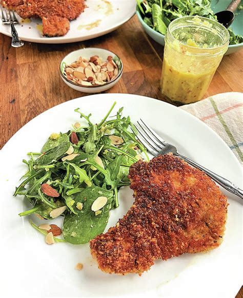 Crispy pork chops with arugula salad elevate dinner