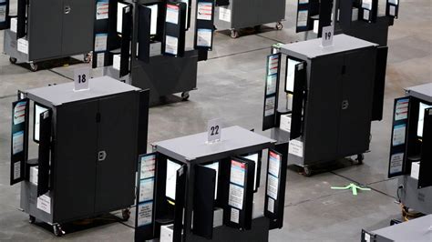 Critics blast Georgia’s plan to delay software updates on its voting machines