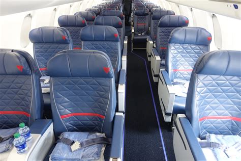 Crj 900 seating capacity. Domestic First. Accommodates twelve in a 1-2 configuration. Zodiac Close Comfort II seats featuring a 6" recline and arranged to a 38" pitch. Main Cabin Extra. Twenty-four seats, configured 2-2 located in rows 8 to 11 and overwing exit rows 15 and 16. B/E Aerospace Spectrum seats featuring a 4" recline arranged to a 35" pitch. 