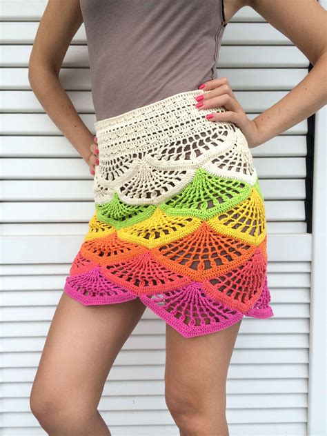 Crochet mini skirt. This mini skirt is fitted and features a crocheted knitted design and a wide elasticized waistband. 