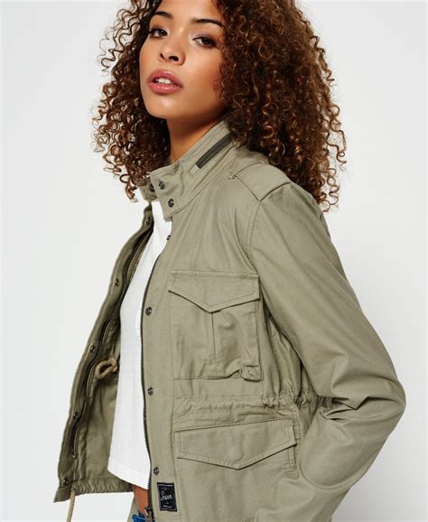 Cropped utility jacket women. Long-sleeve utility jacket from Wild Fable™ made of 100% cotton in a solid hue. Sports a collared front and full-length zipper fastening, along with ribbed trim at the wrists and hemline. Designed with flapped chest pockets and zip pockets on the sides. Cropped length with a classic fit completes the look. 