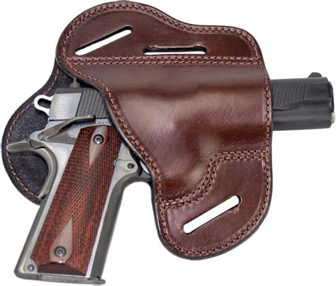 The holster is mounted by running one’s belt through a belt slot on either side of the holster. The reinforced belt slots are 1.5’’ wide by default, but you can ask for their customization to fit virtually any gun belt. This cross-draw holster comes in mahogany and black color and can be ordered for both right and left-handed shooters. 