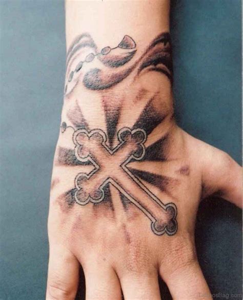 The tattoo with the image of the cross on the arm carries