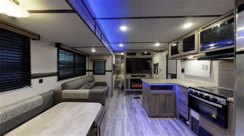 Crossroads rv. Not only is there a multitude of high-end included features, Sunset Trail also comes with many upgrade options such as a second air conditioner, free-standing dining room table and many more! One unique feature is the barreled ceiling. This gives the interior a more spacious feel, helping the Super Lite feel more like home. 