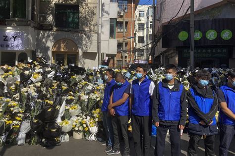 Crowds gather near funeral home, lay flowers as former Chinese Premier Li Keqiang is laid to rest