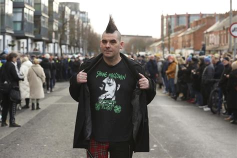 Crowds line Dublin streets for funeral procession of The Pogues singer Shane MacGowan