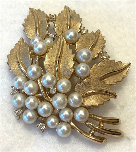 Crown trifari brooch. Crown Trifari Alfred Philippe Flower Brooch-Vintage MCM Trifari Patent No. 172560 Faux Pearls Rhinestone Brooch. (700) $54.00. FREE shipping. My Garden - Vtg Signed & Unsigned Pins, Brooches, Earrings. 