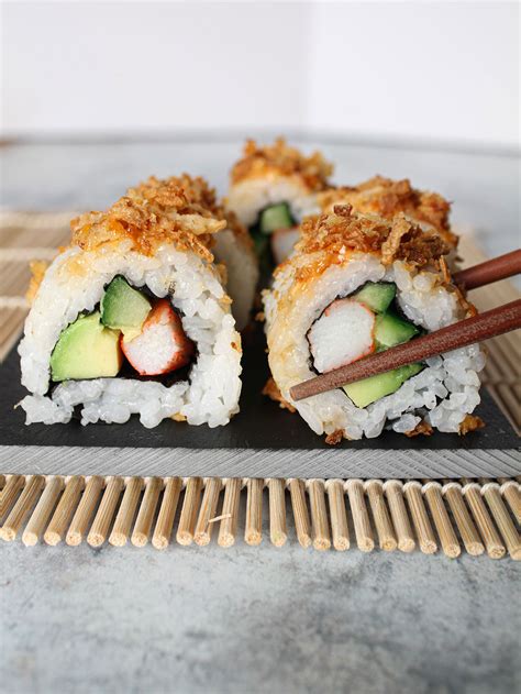 Crunchy sushi. Soak the sushi rice in water for 10 minutes and rinse until the water runs clear. Put the rice in a saucepan, cover with water, bring to boil and cook on high heat for 5 minutes. Then simmer on a medium heat for 10 minutes until the rice water is absorbed. Meanwhile mix the rice vinegar, salt and sugar in a small jug or bowl. 