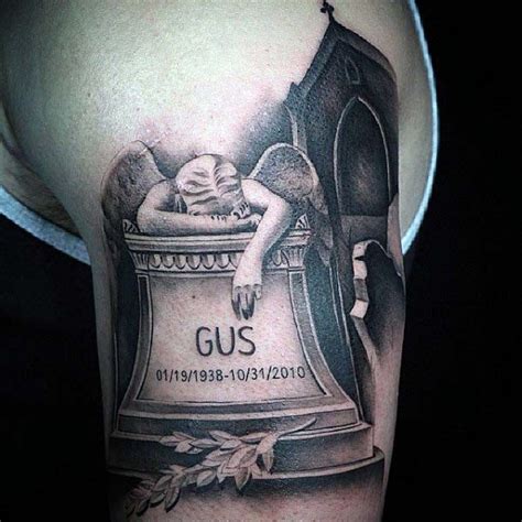 Crying angel on gravestone memorial shoulder tattoo with lettering and