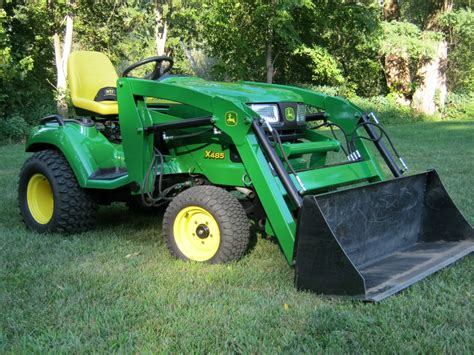 Attaching your Little Buck Loader to your John Deere x758 is as easy as 1-2-3! Place the loader over the weight bar, insert the hoses, and set the spring-loa...