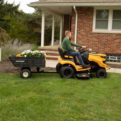 Product Details. This versatile yard tool is a 2-wheel cart designed to attach to Cub Cadet lawn and garden tractors or zero-turn mowers. 4 collapsible sides allow the Hauler to be folded flat and stored vertically, taking up 70% less space in a garage or shed compared to traditional yard carts. . 