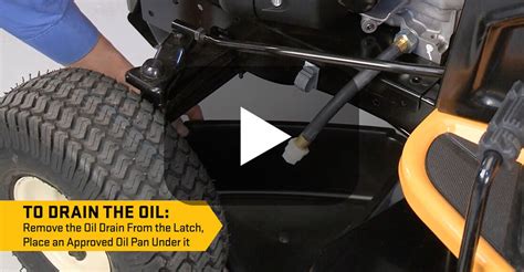 Here is how to change the oil on a Cub Cadet XT2 tractor. Place a piece of cardboard under the work area to catch oil drips and use an oil basin to catch the used oil as it is drained from the engine. Use a rag to clean around the oil fill and drain areas to prevent debris from entering the engine. Remove the dipstick.